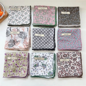 Floral and checkered cotton handkerchiefs with delicate crochet lace borders in a collection