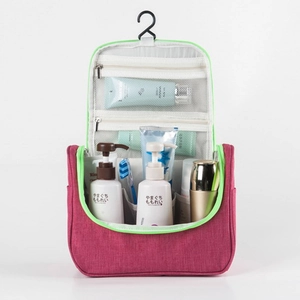 Hanging travel toiletry bag in rose red and neon green with multiple mesh compartments