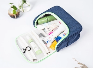 Detail view of large travel toiletry bag with hanging hook and multiple mesh compartments