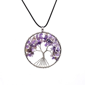 Detailed close-up of Tree of Life pendant with purple amethyst stones on black cord