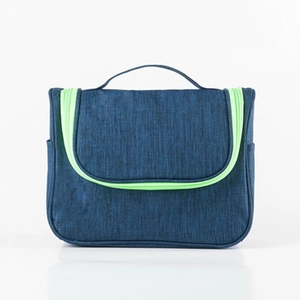 Large dark blue travel toiletry bag with neon green zippers and top carry handle