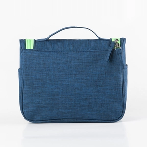 Large capacity travel toiletry bag with grey fabric and green zipper accents
