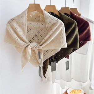 Three hollow knit striped triangle scarves in cream, green and brown with tassels