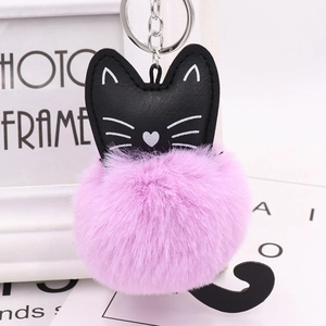 Cute black cat keychain with large pink faux fur pompom and silver metal link chain