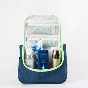 Detail view of large travel hanging toiletry bag with deep main compartment and mesh pockets