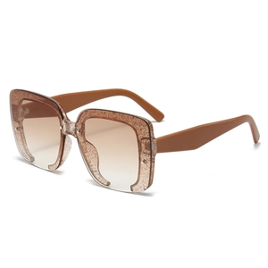 Square glitter sunglasses with brown gradient lenses and oversized sparkly frame