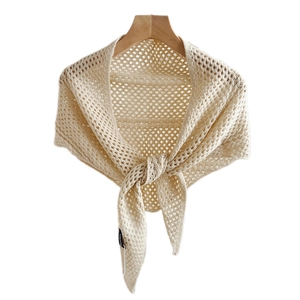 Elegant beige hollow knit triangular shawl scarf for women displayed on a wooden hanger