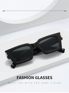 Detail of square black sunglasses with silver accents on white geometric steps