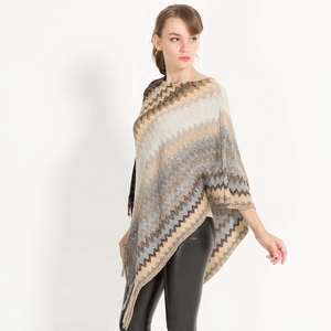 Women's autumn knit poncho shawl with wave stripes, fringes and loose fit silhouette