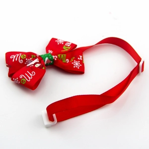 Close-up of red Christmas pet bowtie with snowman motif and adjustable plastic buckle