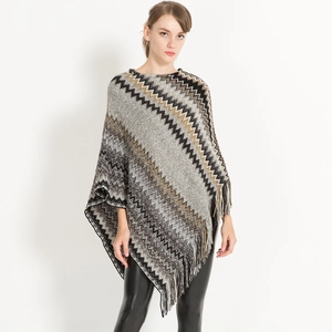 Women's autumn knit poncho featuring grey and khaki wavy stripes with fringe hem detail