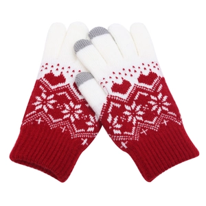 Detail of red and white knit gloves featuring heart patterns and touchscreen fingertips