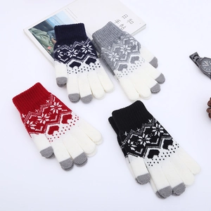 Detailed view of four-color winter knit gloves featuring snowflake patterns and touch screen tips