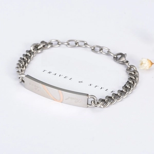 Titanium steel couple bracelet with Cuban chain and engraved Love Real metal plate