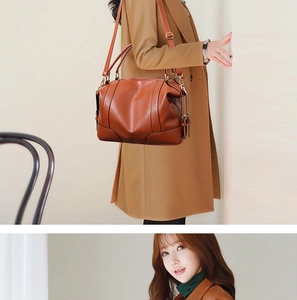 Brown lychee-texture leather handbag shown in a lifestyle crossbody style on a camel coat