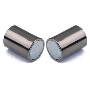 Macro shot of dark grey cylindrical magnetic clasps with high-gloss metallic finish