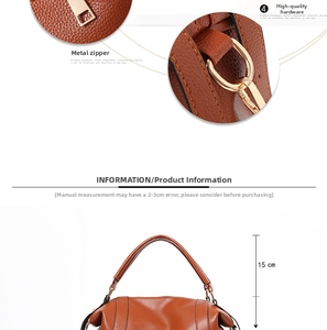 Detail view of brown lychee texture handbag with 15cm handle and golden hardware