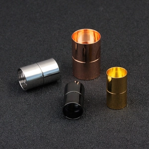 Macro view of cylindrical magnetic jewelry clasps in silver, gold, rose gold and black