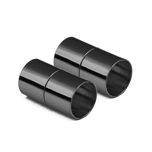 Detailed macro view of black cylindrical magnetic jewelry clasps with polished finish