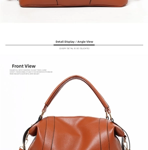 Detail view of brown lychee grain leather tote with sturdy handle and metallic ring