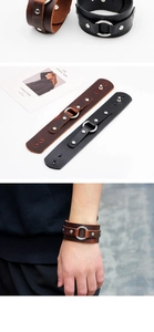 Close-up of retro punk wide leather bracelet with silver metal rings and rivets