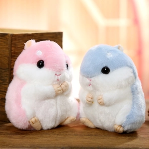 Cute plush hamster keychains in pink and blue colors with soft furry texture