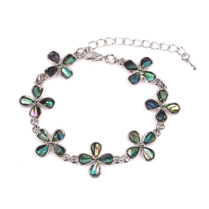 Silver flower bracelet featuring rainbow abalone shell inserts and adjustable lobster clasp