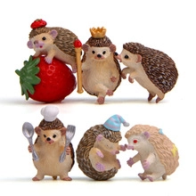 Macro detail of six cute resin hedgehog figurines with various decorative accessories