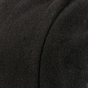 Close-up of black fleece fabric texture for minimalist windproof autumn winter beanie hat
