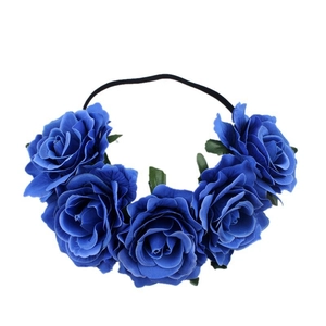 Bohemian floral headband with five dark blue roses and green leaves on black elastic band
