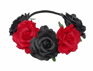Detailed view of red and black artificial roses on a bohemian style festive floral headband