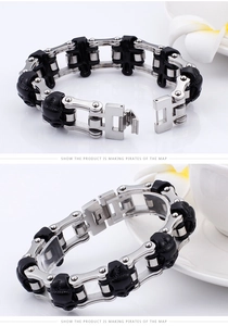 Detail view of the metal buckle clasp and skull link chain on a biker style bracelet