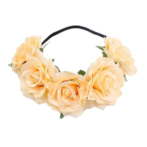 Detail of cream artificial rose flower headband with realistic petals and green leaves