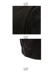 Close-up of the plush texture and neat stitching on a warm black winter beanie cap