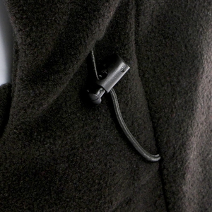 Minimalist black windproof fleece beanie with adjustable elastic drawstring and plastic toggle