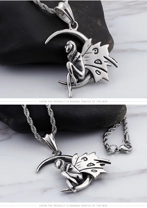 Detail of silver fairy sitting on crescent moon pendant with braided chain necklace