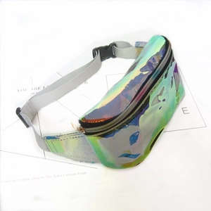 Flat lay of iridescent PVC waist bag with reflective metallic finish and nylon strap
