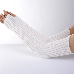Close-up of white ribbed knit arm warmers with thumb holes and soft texture detail