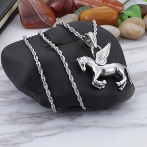 Polished stainless steel flying horse pendant necklace with rope chain on gray stone
