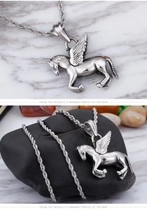 Detailed macro view of vintage stainless steel pegasus wing pendant with braided chain