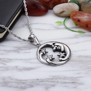 Elegant silver star and moon pendant necklace on a premium marble textured background
