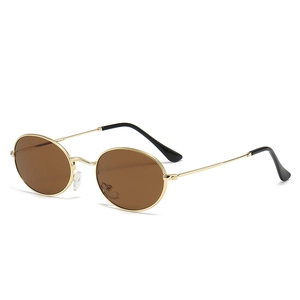 Vintage oval sunglasses with gold metal frame and brown lenses for a retro punk style