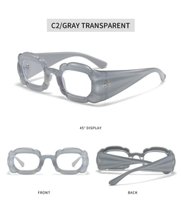 Three perspectives of gray transparent Y2K sunglasses with thick wavy frame detail