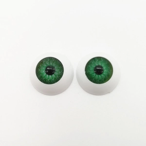 Macro detail of 20mm green round plastic toy eyeballs for DIY craft accessories