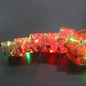 Christmas tree ribbon lights with red gold gauze and colorful LED glowing decorations