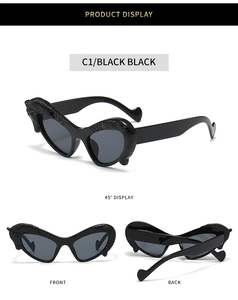 Three-way view of black cat-eye sunglasses with detailed flame-shaped relief on the frames