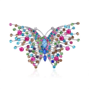 Close-up of butterfly brooch with multi-colored rhinestones on silver metal frame