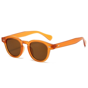 Lunettes de soleil ovales rétro à monture ambre avec rivets argentés élégants