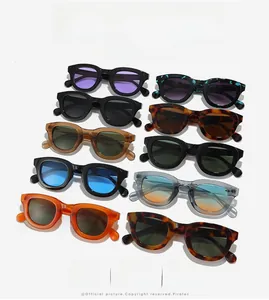 Flat lay display of colorful vintage oval sunglasses with thick frames in various vibrant colors