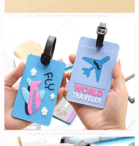 Detail of 3D PVC luggage tags with airplane designs and buckle straps held by hands
